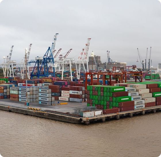 A busy container port with stacked shipping containers, the kind of supply chain Can-e-Buy manages for its clients